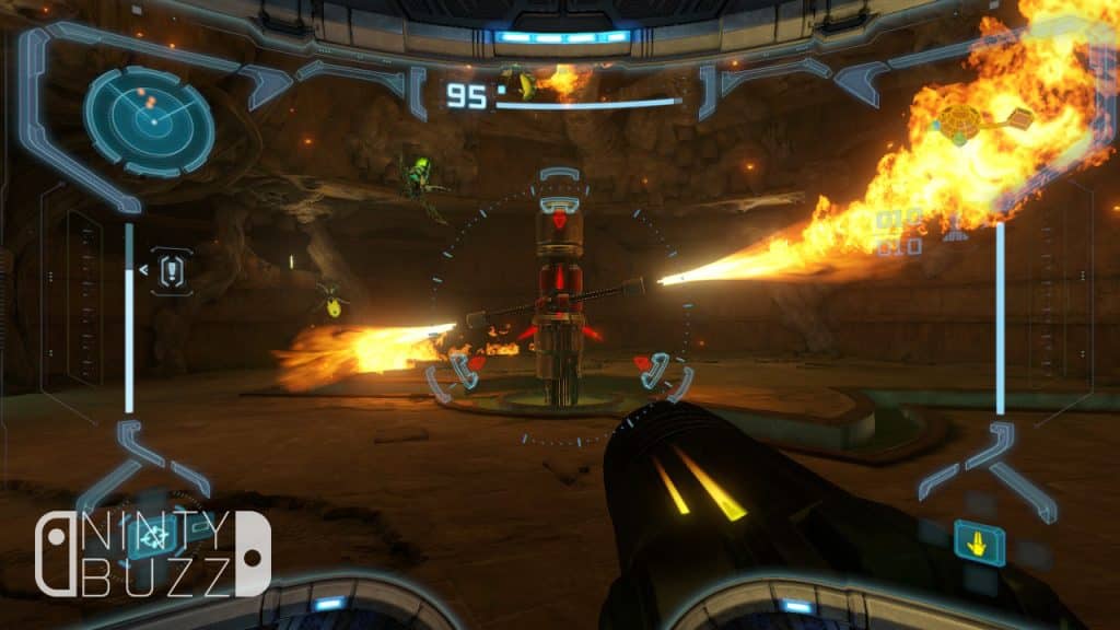 A view behind Samus' visor of her aiming her arm cannon at a robotic flamethrower.